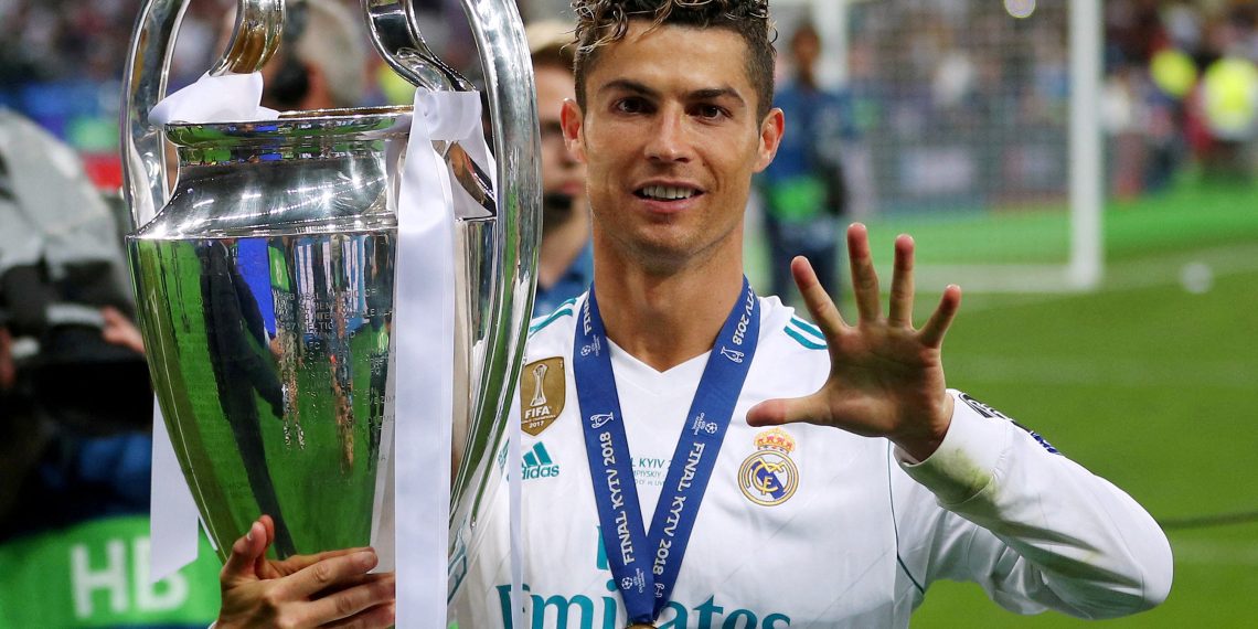 FILE PHOTO: Soccer Football - Champions League Final - Real Madrid v Liverpool - NSC Olympic Stadium, Kiev, Ukraine - May 26, 2018   Real Madrid's Cristiano Ronaldo gestures as he celebrates winning the Champions League with the trophy   REUTERS/Hannah McKay    /File Photo